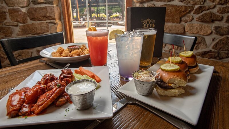 Multiple appetizers and dinks on a table