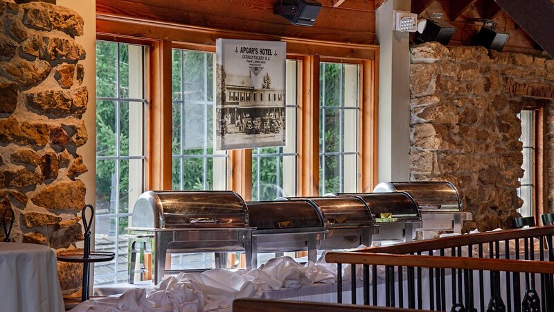 Chafing trays on long table in private party area
