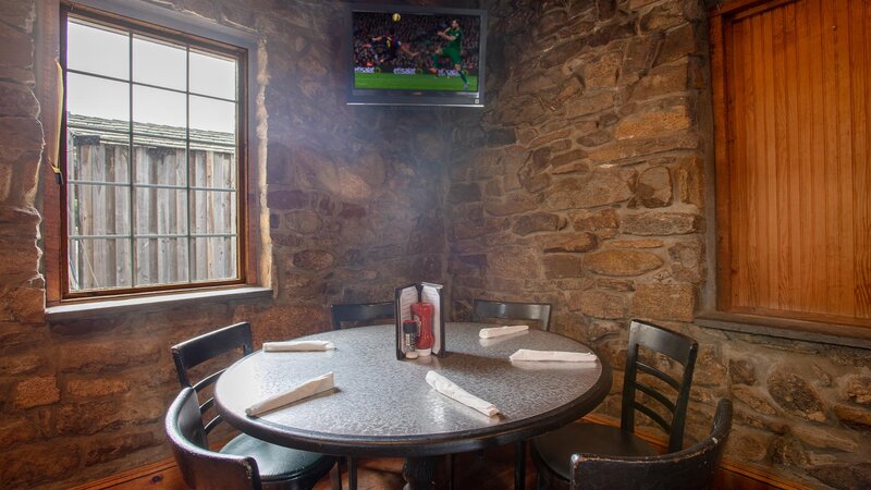 Round table in downstairs dining room set for six