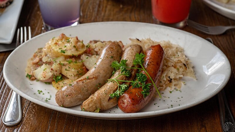 Knockwurst, bratwurst and weisswurst entree with potaotes and sauerkraut