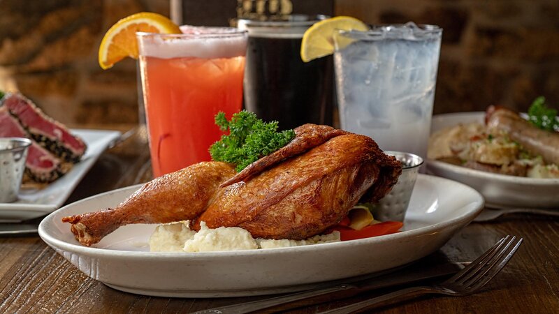 Roasted herb crusted chicken with a side of mashed potatoes