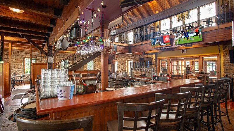 Bar with view of upstairs dining room
