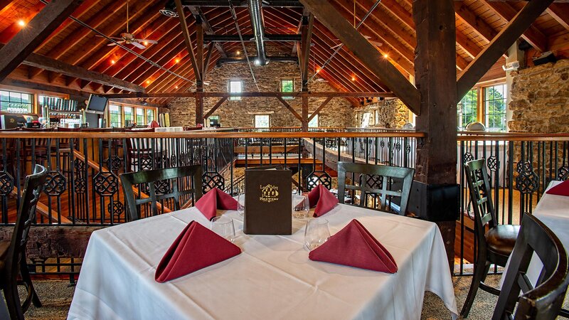 Private dining room with focus on square table set for four guests